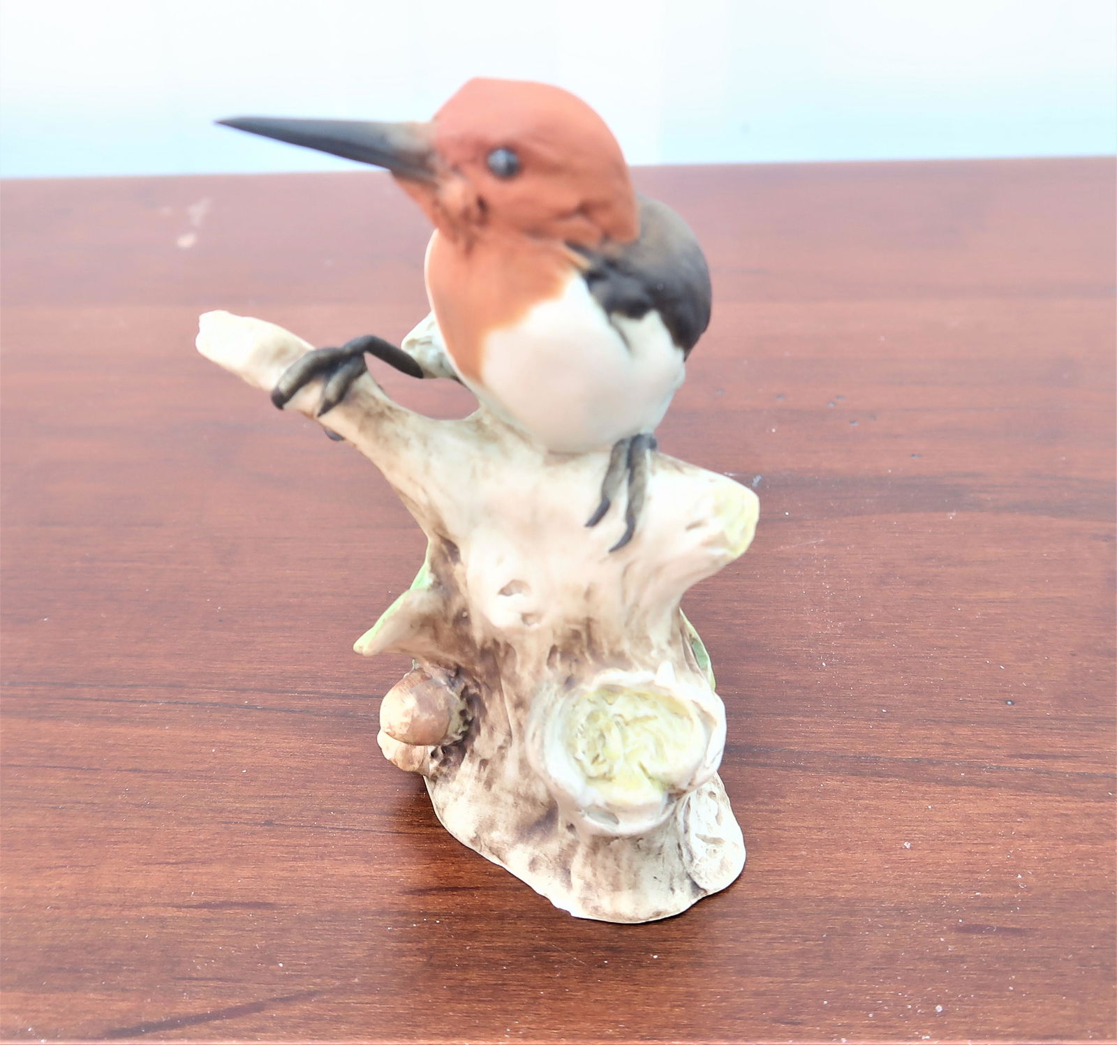 Porcelain Red Headed Woodpecker Signed Tay: Size: 4"H x 3", Porcelain Red Headed Woodpecker Signed Tay.