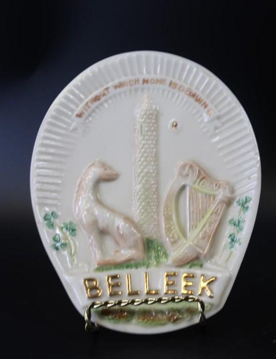 Belleek Collectors Society trademark Plaque"Without: Lovely plaque from Belleek, showing their trademark 'Without which none is genuine', with an Irish Wolfhound, tower, harp and shamrock/ along with jewelry container. The word 'Belleek' is gilded. Issu