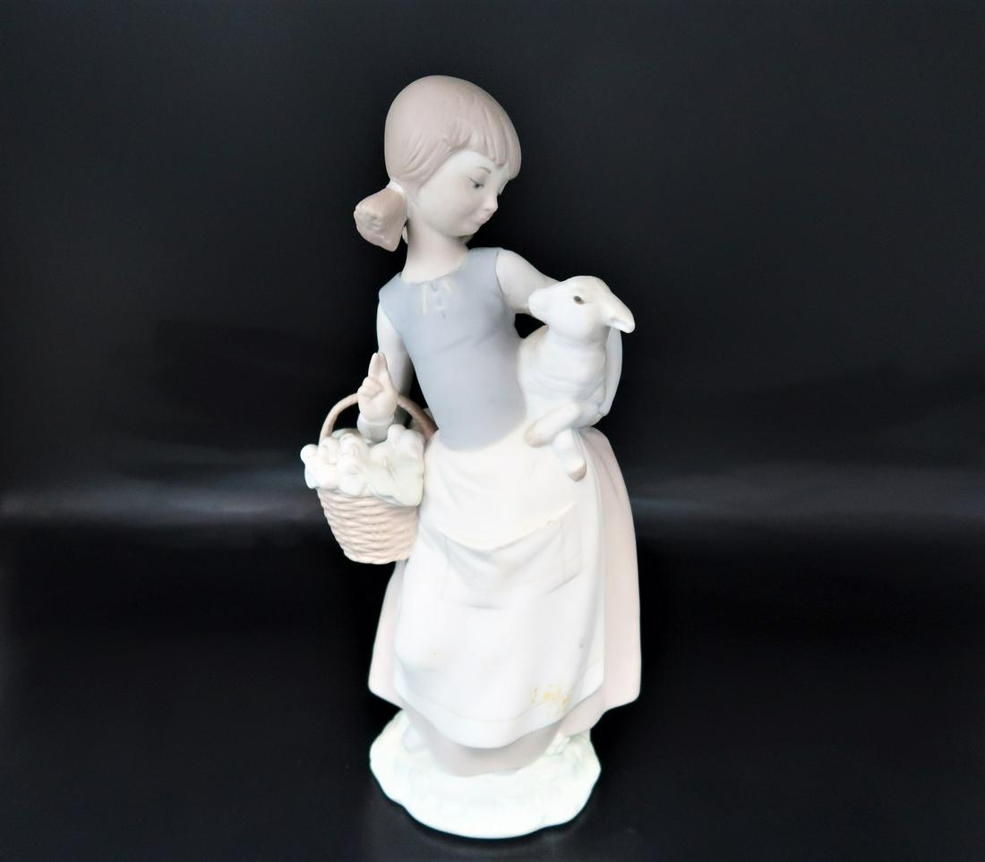by LLardro Girl Holding baskit & Baby Lamp: LLardro Girl Holding baskit & Baby Lamp with stamp on the bottom. size: 10 3/4" x 4" x 3 1/2". Hand made in Spain