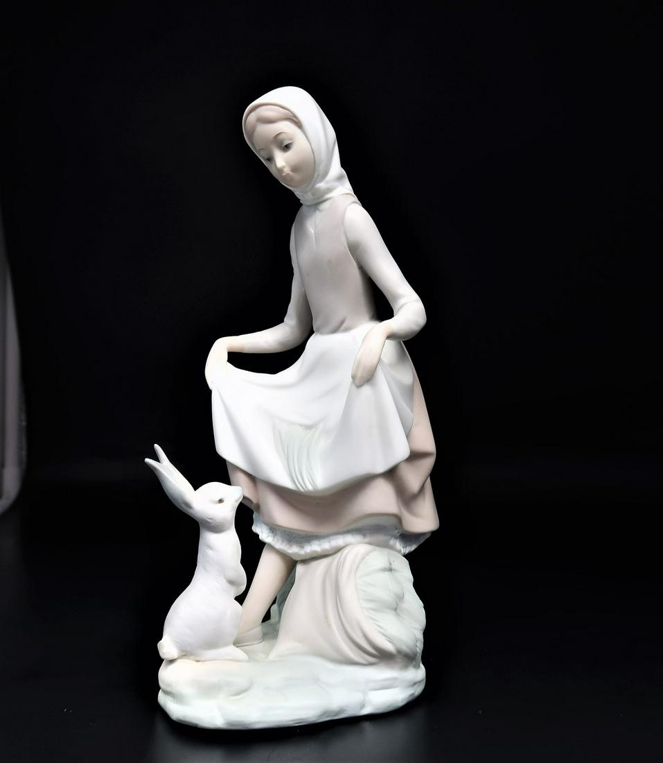 by LLadro "Feeding Bunny" Retired 1994: by LLadro Girl "Feeding Bunny" retired 1994 . Size: 9" x 4 1/2" x 4 1/2" - Style 4826 MATTE, Piece Code: NB93