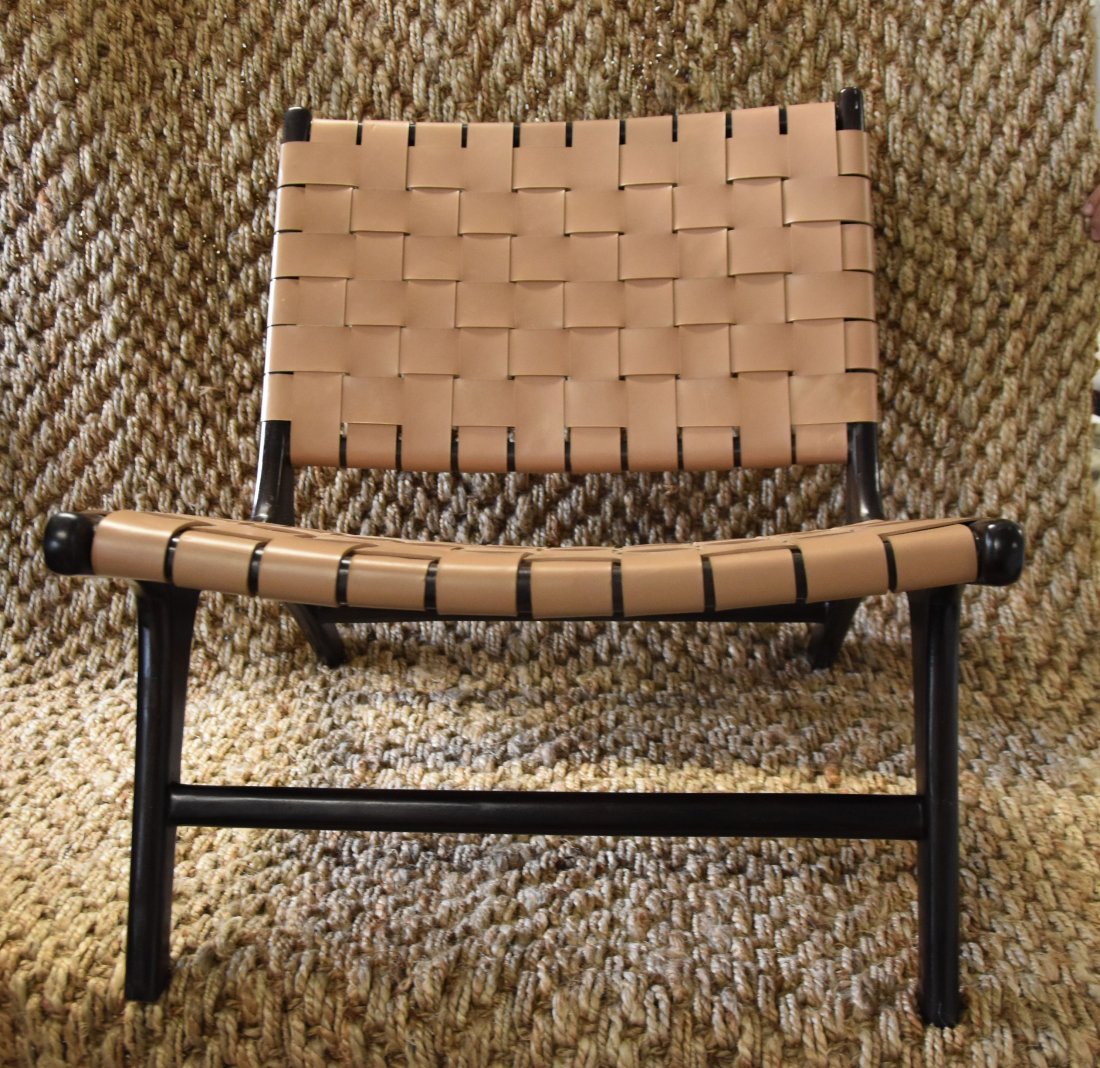 Catania tan chair: The Catania chair is made with a palisander wood base and woven leather seating. This lounger is perfect for any living area and makes a great statement piece for the home or office. Seat height is 15