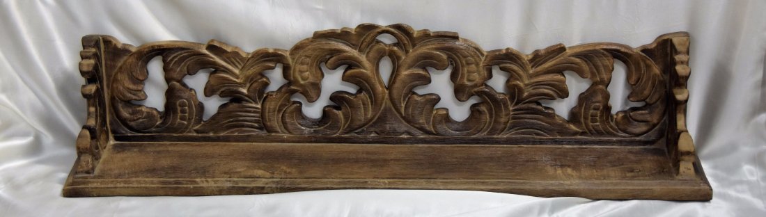 Carved wall shelf: Carved wooden wall shelf. 35L x 8H x 6D in