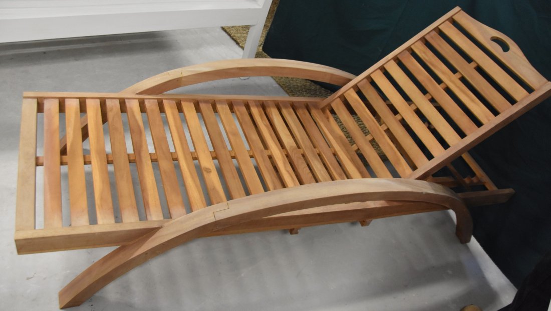 Ships lounge chair: Ships lounge chair made from teak wood with collapsible back. With retractable side tray. Arm height is 19in. 80in Long. Back height is 36in. Width is 29in.