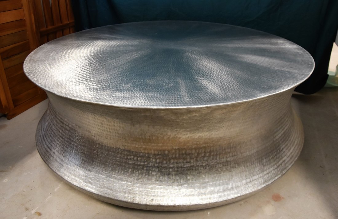 Dongson coffee table: The Dongson Coffee Table boasts a textured aluminum to compliment a wide array of seating areas. It is treated for both indoor and outdoor use. 17H x 45W in