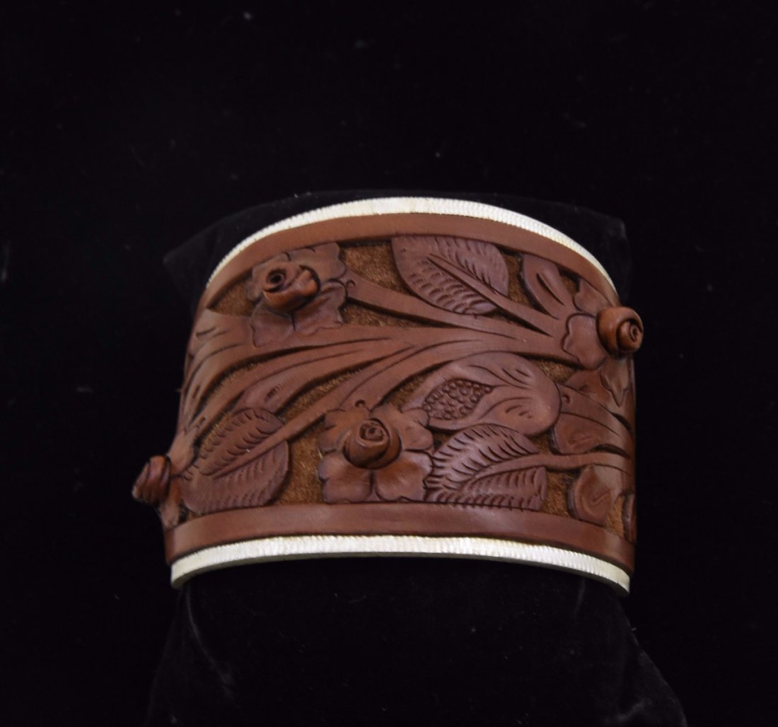 Ralph lauren cuff: Ralph lauren cuff carved leather on silver marked ralph lauren Dimensions: 2.5 x 2 3/4 inches