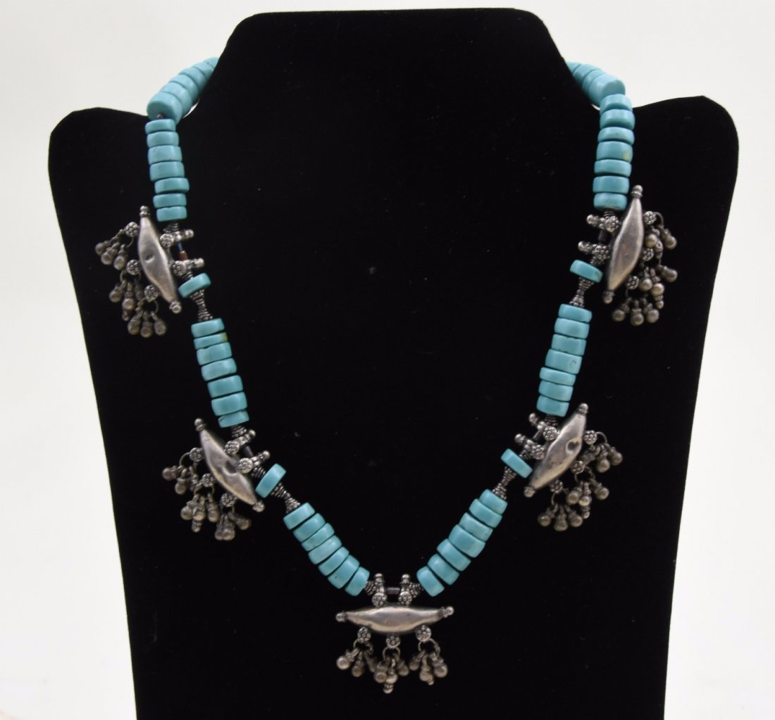 Turquoise and sterling silver necklace: Turquoise and sterling silver necklace Tribal trade beads Dimensions: 18in long