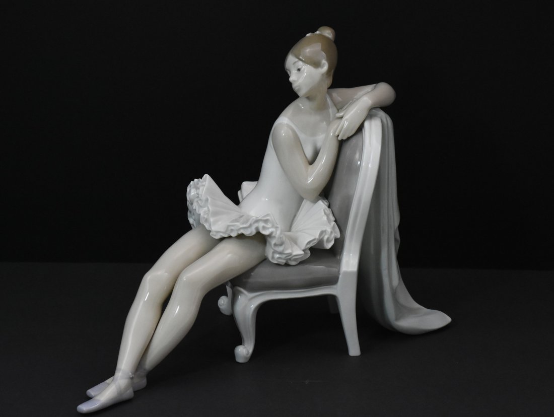 Lladro porcelain ballerina on chair "spain": Classic porcelain ballerina on a chair. Lladro spain. 9 1/4"H x 13"L x 8"W