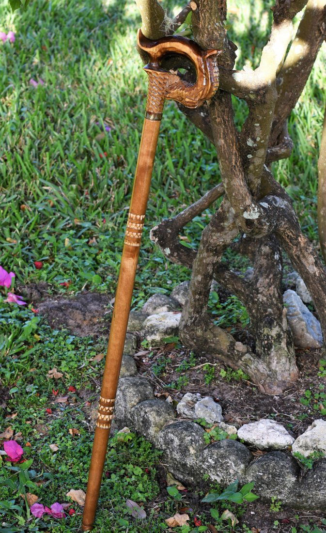 Wooden arts and craft cane from the 80's: 35"H x 1 1/4W. Handle length is 6 1/2" Arts and craft cane.