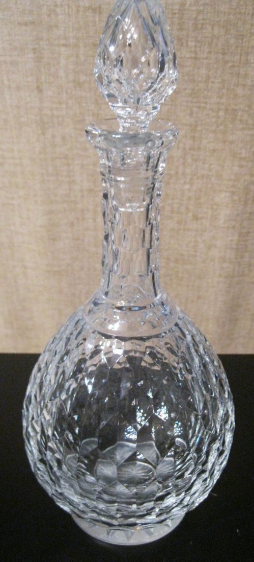 Gorgeous Baccarat Cut Crystal Decanter: Elegant Cut Crystal Decanter by: Baccarat. Measures 13" Including Stopper. Marked On Bottom Baccarat France. Has slight chips at the top. Hardly Noticeable