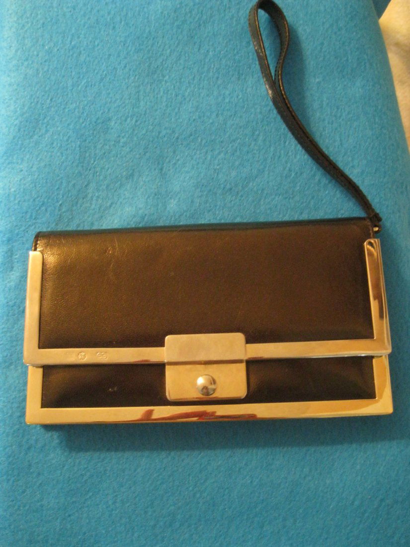 Escada Leather Wallet w/ Metal Hardware Trim: Escada Dark Bronzed Leather Wallet with metal hardware and wrist strap. 7.5" x 4" Leather has minor wear and tear.