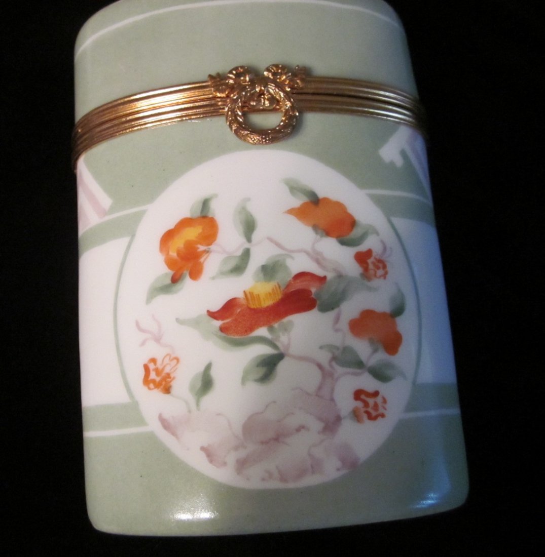 Limoges le Tallec for Tiffany & Co. Hinged Box-Vin: Limoges le Tallec for Tiffany & Co Porcelain Gold Hinged Box. Private Stock Made in France. Numbered 1214. From the 1960's. Hanpainted flowers (orange, white, yellow w/ green leaves. Color is celery g