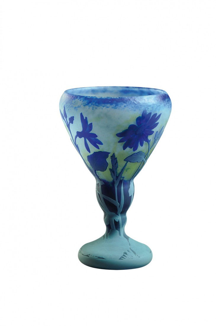 DAUM NANCY: A fine carved, martele and etched cameo glass vase. It features gray etched leaves and stems extending upwards to brilliant blue «cinéraria» flowers finely wheel-carved on a mottled martele finish