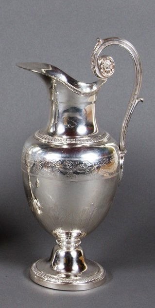 A Charles X silver covered ewer, circa 1825: A Charles X silver covered ewer, makers mark of Louis MANANT, Paris, circa 1825, of amphora form with borders of leaf-tips, lightly chased with a band of grapevine above a band of stiffleaves and rush