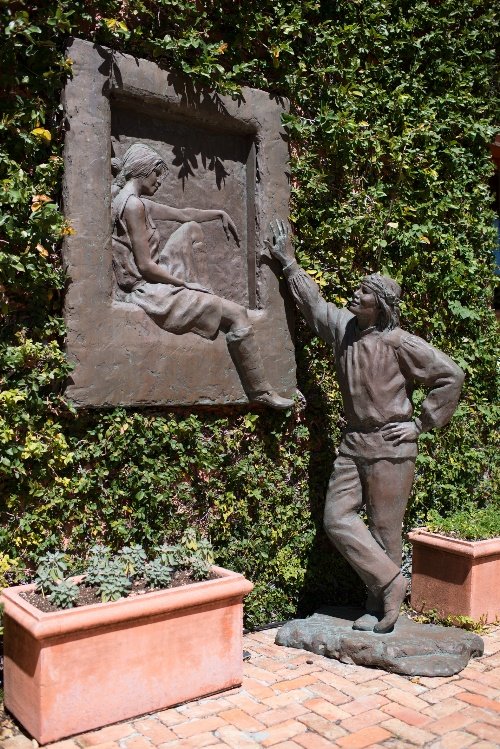 Ya Ta Hey, 1990: Glenna Godacre (b. 1939) Ya Ta Hey, 1990 Bronze Sculpture; inscribed and dated on lower right “G. Goddacre 1990,” numbered 7/15. Wall relief of Indian woman in window frame and standing male India
