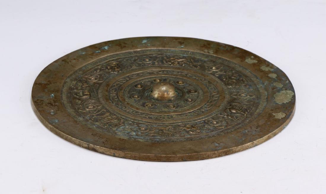 A CHINESE ANTIQUE BRONZE MIRROR (1 of 3)