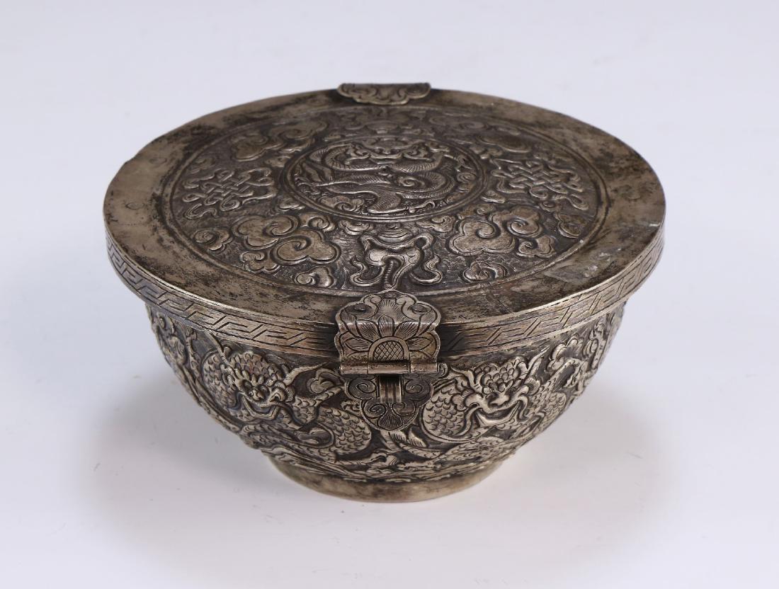 A CHINESE ANTIQUE SILVER LIDDED BOWL: A Chinese Antique Silver Lidded Bowl: Designed With Blooming Flowers And Growing Plant Stalks, With A Removable Lid; Size: D: 6" (15.24cm)
