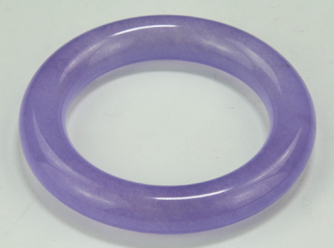 A TRANSLUCENT LAVENDER JADEITE BANGLE (1 of 3)