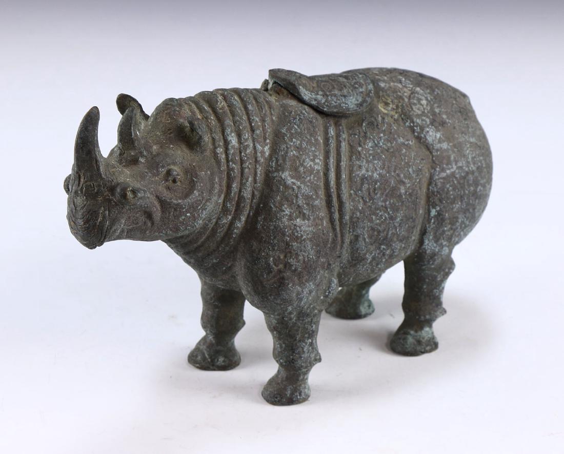 A CHINESE ANTIQUE BRONZE RHINOCEROS (1 of 5)