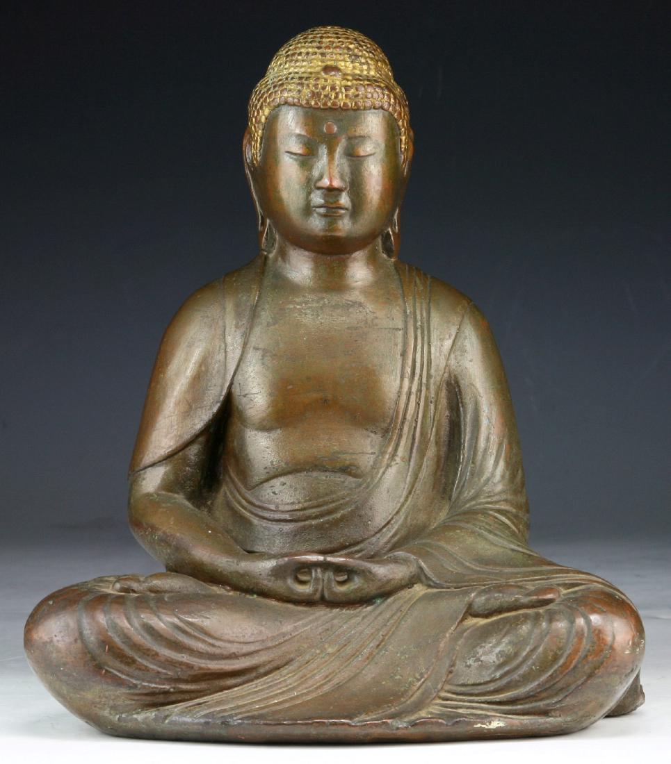 A CHINESE ANTIQUE BRONZE BUDDHA: A Chinese Antique Bronze Buddha; Size: H: 9-1/4" (23.5cm)
