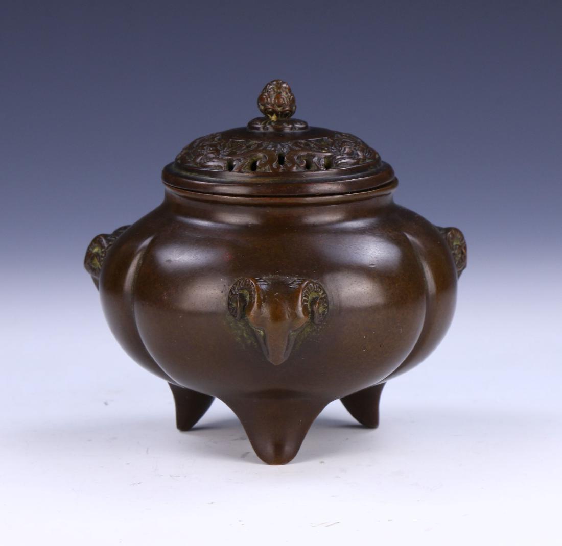 A CHINESE ANTIQUE LIDDED TRIPOD BRONZE CENSER (1 of 7)