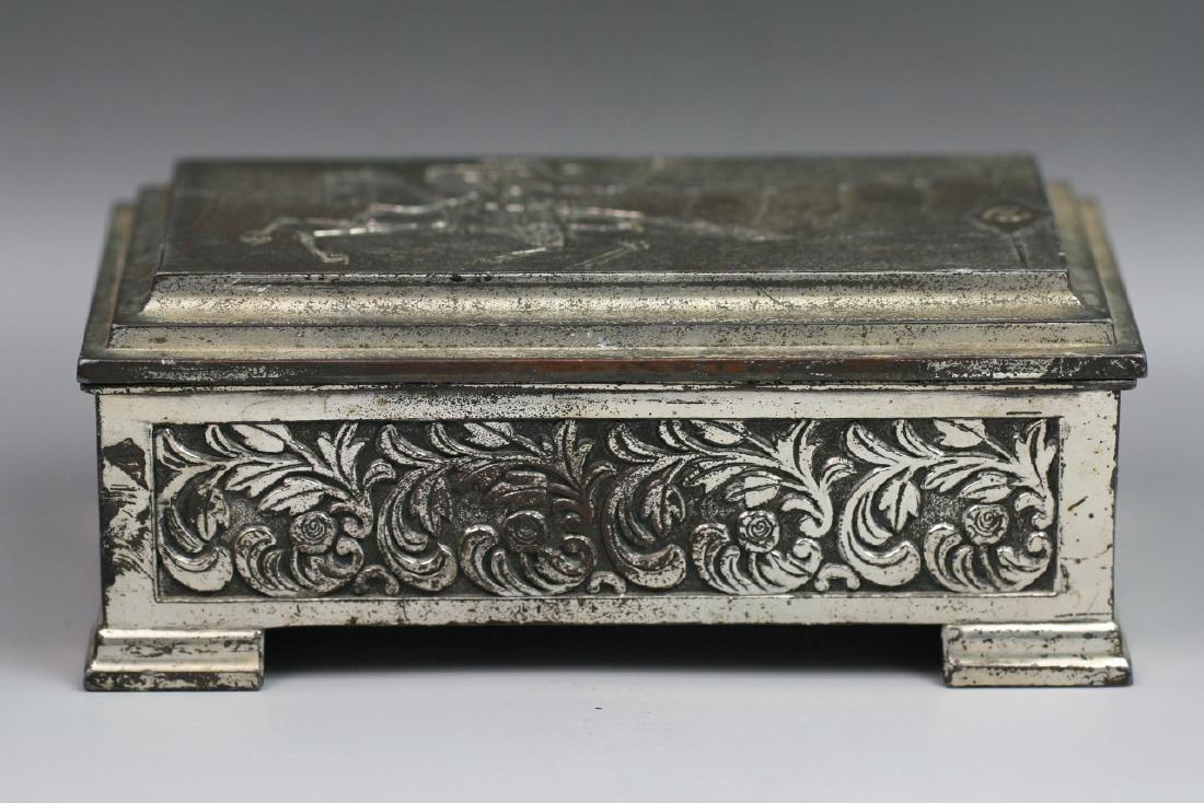 FINE JAPANESE ANTIQUE SILVERED TRINKET BOX: Fine Japanese Antique Silvered Trinket Box: Fine Japanese Silvered Trinket Box: The Cover Finely Carved With A Warrior Riding On A Horse Carrying A Bow in His Hand, With Scrolling Vines On Four Sides,
