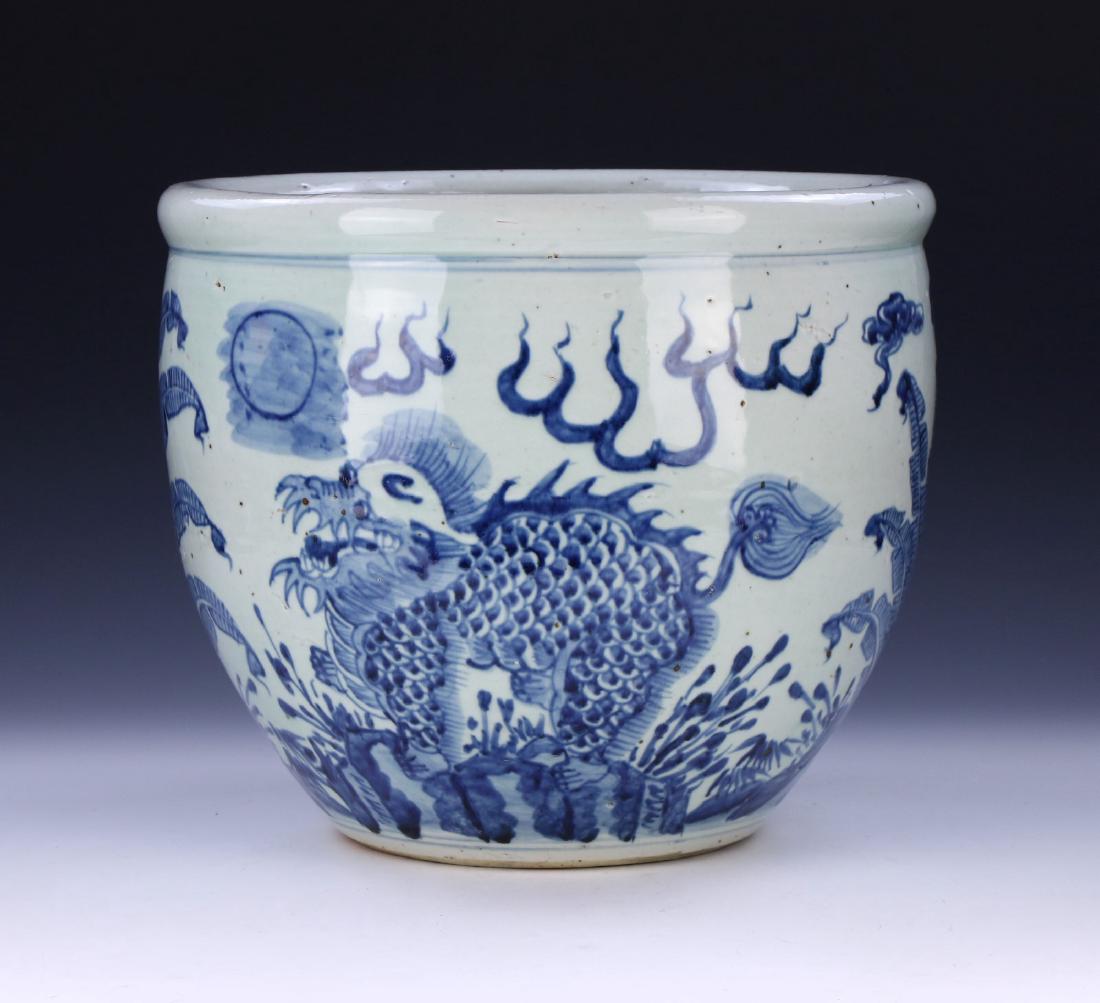 A CHINESE ANTIQUE BLUE & WHITE PORCELAIN JAR: A Chinese Antique Blue & White Porcelain Jar: Well Potted And Of Globular Form, Rising From A Wide Base Rested On Low Feet To A Lipped Rim, Body Finely Painted With Two Dragons Within A Field Amid Spr