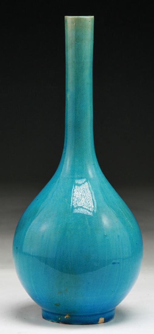 A CHINESE ANTIQUE BLUE GLAZED PORCELAIN VASE: A Chinese Antique Blue Glazed Porcelain Vase: Of Peared Shaped With Slender Cylindrical Neck, Applied Overall With A Bright Blue Glaze; Size: H: 8-1/2" (21.59cm)