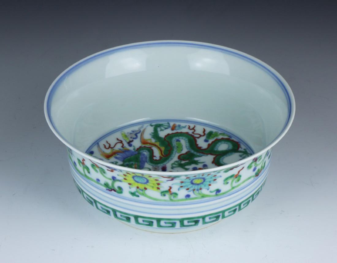 A CHINESE DOUCAI 'DRAGON AND PHOENIX' PORCELAIN BOWL (1 of 5)