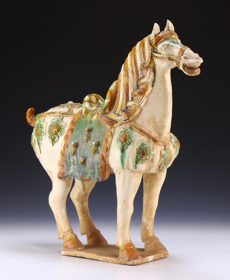A CHINESE ANTIQUE POLYCHROME POTTERY HORSE (1 of 6)