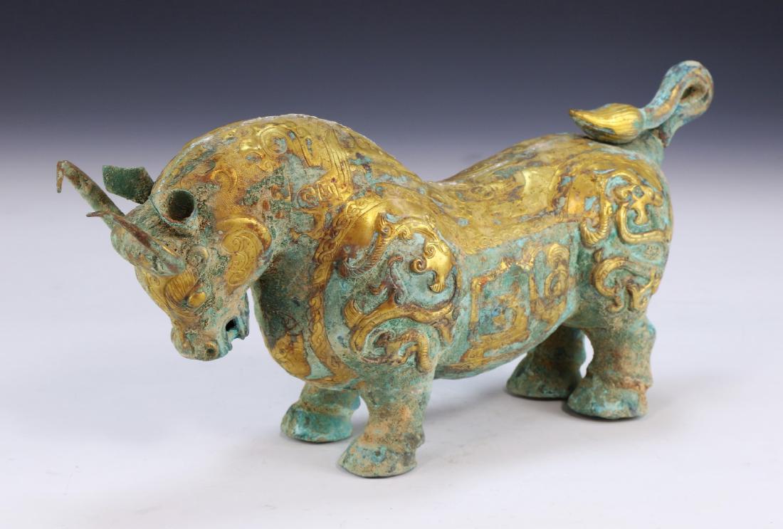A CHINESE ANTIQUE GILT BRONZE OX FIGURE (1 of 5)
