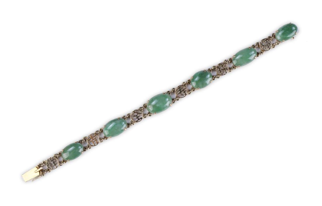 A JADEITE BEADED BRACELET (1 of 4)