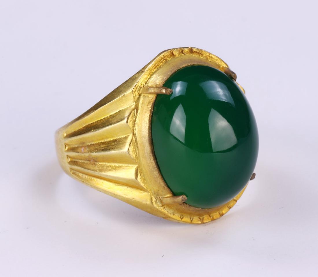A GREEN JADEITE RING (1 of 3)