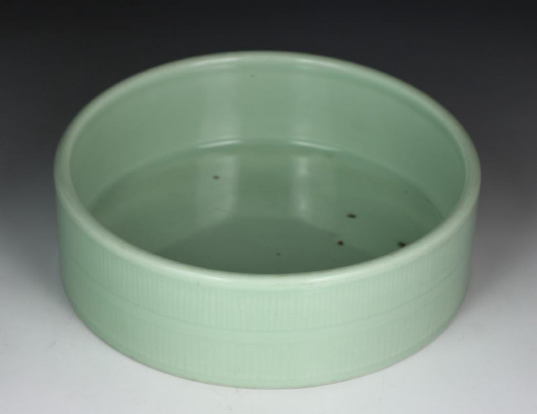 A CHINESE ANTIQUE CELADON GLAZED PORCELAIN BOWL: A Chinese Antique Celadon Glazed Porcelain Bowl: Well Potted And Of Cylindrical Form, Six Character YONGZHI Mark On The Base in Cobalt Blue; Size: D: 9-1/2" (24.13cm)