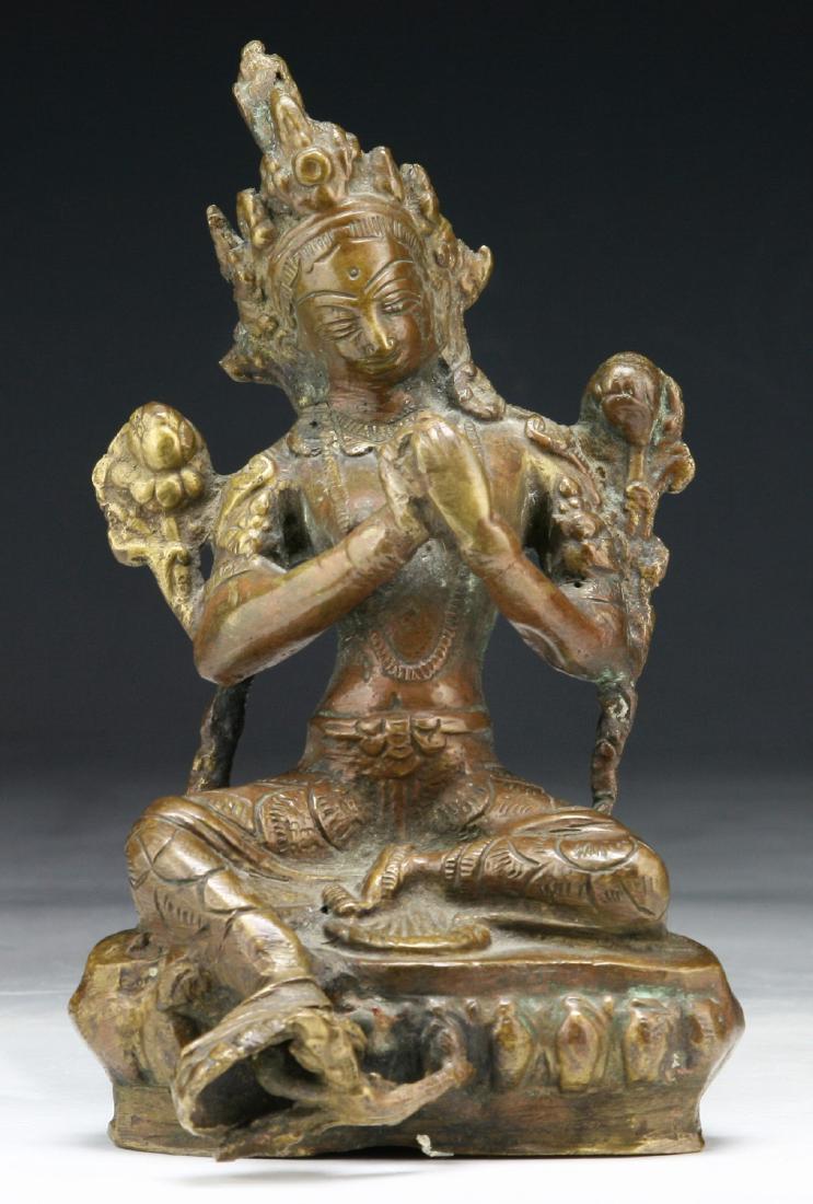 A CHINESE ANTIQUE BRONZE TARA: A Chinese Antique Bronze Tara: Finely Cast, Shown Rising From A Domed Plinth And Draped in Loose Robes, Hair Pulled Behind An Elegant Headdress; Size: H: 6-3/4" (17.15cm)
