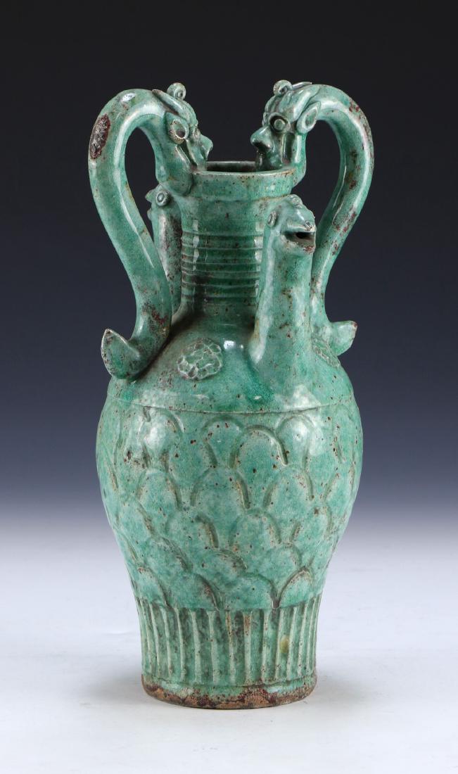 A CHINESE ANTIQUE CELADON GLAZED PORCELAIN VASE: A Chinese Antique Celadon Glazed Porcelain Vase: Of Bulbous Form, Rising To A Cylindrical Neck And Splayed Rim Flanked On Each Side By Well Potted Dragon Form Handles, Vase Shoulders Finely Molded Wit