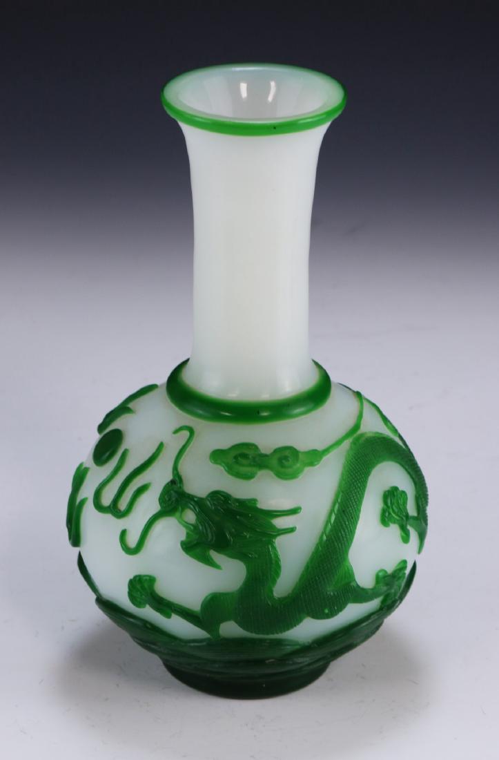 A CHINESE ANTIQUE OVERLAY PEKING GLASS VASE: A Chinese Antique Overlay Peking Glass Vase: Of Globular Form, Milky White Opaque Glass Overlaid With Skillfully Carved Green Dragons And Clouds, Four Character QIANLONG Mark On The Base Within A Doub