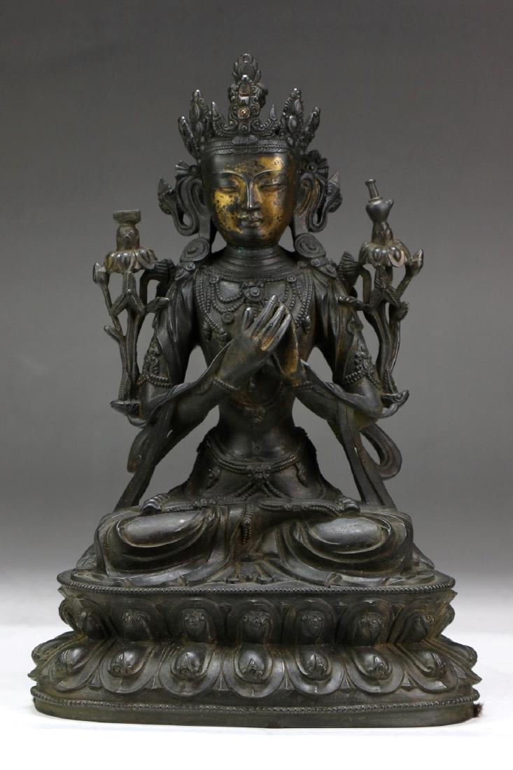 A TIBETAN ANTIQUE GILT BRONZE MAITREYA FIGURE: 十八世紀西藏銅鎏金彌勒菩薩像A Tibetan Antique Gilt Bronze Maitreya Figure: Seated on double lotus plinth, his hands