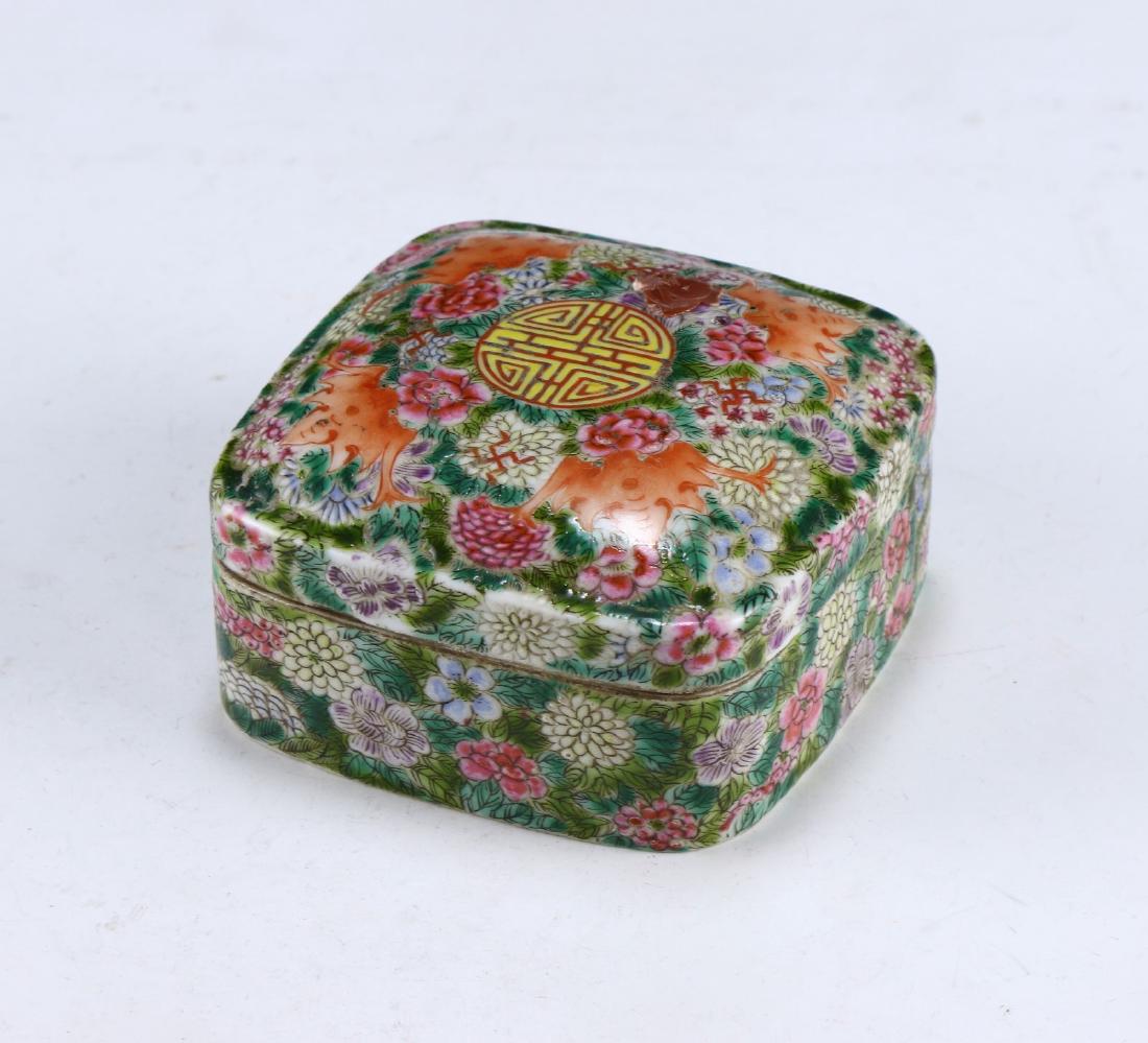 A CHINESE ANTIQUE FAMILLE ROSE PORCELAIN LIDDED CASE: A Chinese Antique Famille Rose Porcelain Lidded Case: Finely Potted And Of Squared Form, Cover Painted With Four Bats Surrounding A Singular Medallion, Each Set Against Continuous Blooming Flowers Of