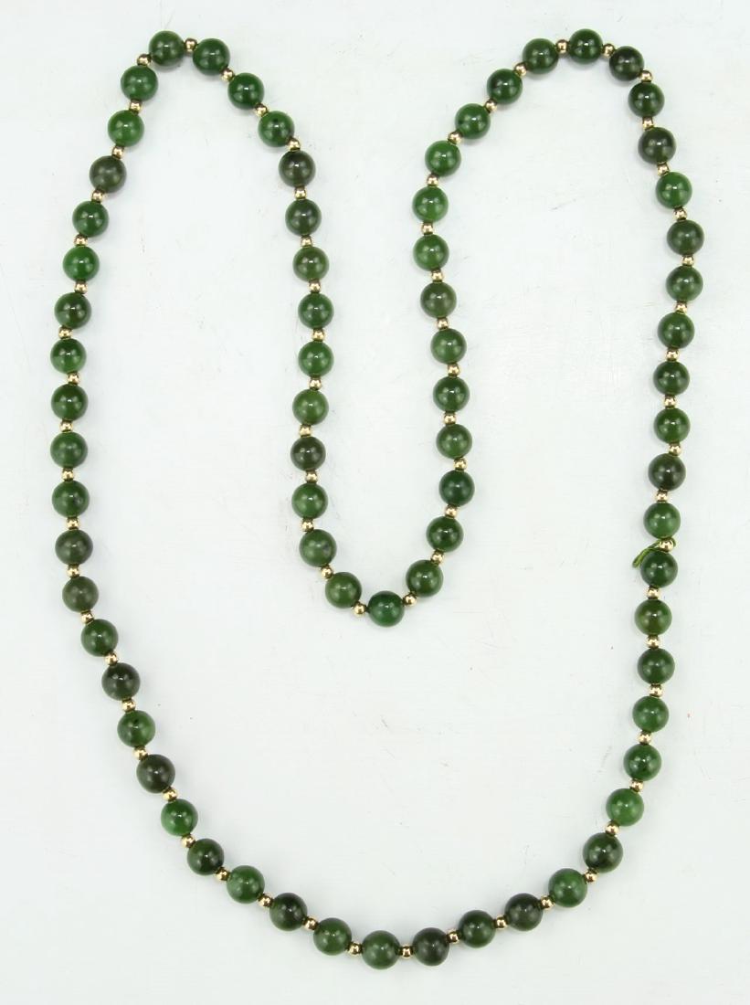 A SPINACH JADE BEADED NECKLACE (1 of 2)