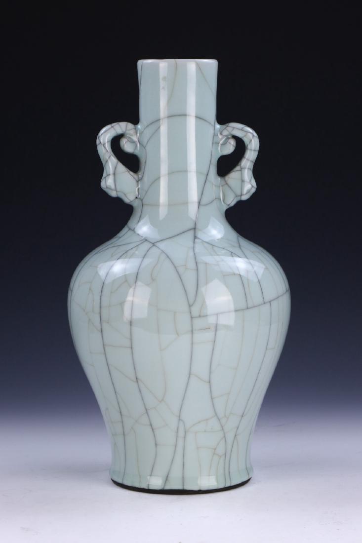 A BIG CHINESE ANTIQUE CELADON GLAZED PORCELAIN VASE: A Big Chinese Antique Celadon Glazed Porcelain Vase: Of Baluster Form, Cylindrical Neck Flanked On Each Side By Well Potted Scrolling Handles, Body Evenly Glazed in A Medium Celadon Tone With A Fine C