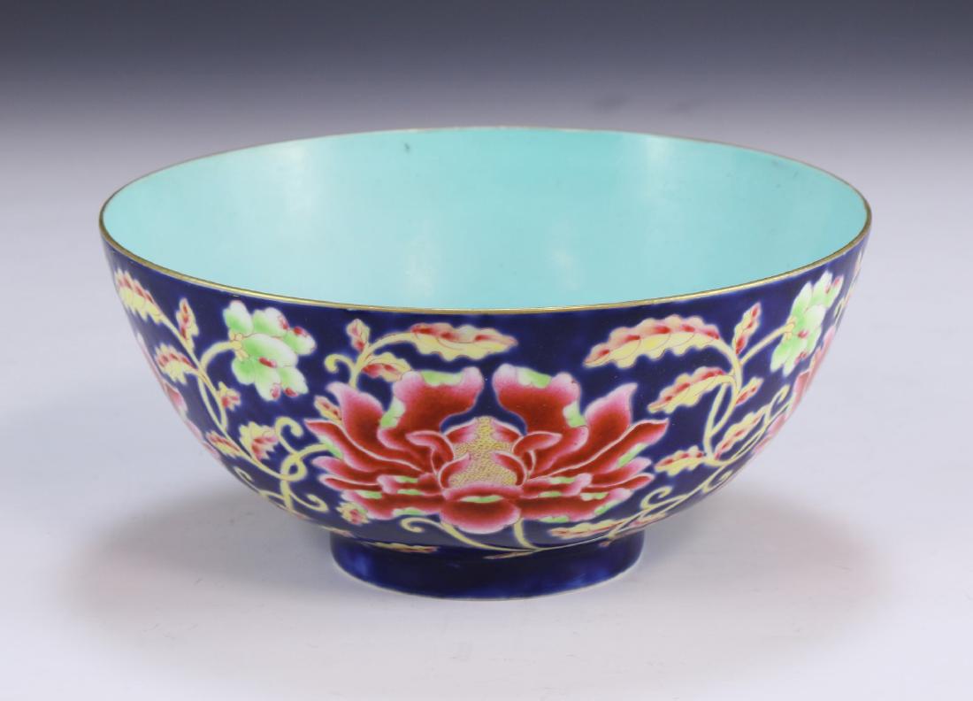 A CHINESE ANTIQUE ENAMEL FALANGCAI PORCELAIN BOWL: A Chinese Antique Enamel Falangcai Porcelain Bowl: The Exterior Finely Painted With Blossoms And Scrolling Leafy Branches On A Bright Blue Ground, The interior With An Even Turquoise Glaze, A Six Char