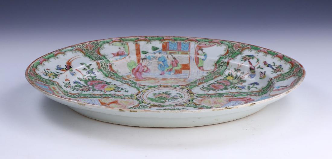 A BIG CHINESE ANTIQUE FAMILLE ROSE PORCELAIN PLATE: A Big Chinese Antique Famille Rose Porcelain Plate: Well Potted, Rising From A Flat Base To A Lipped Rim, interior Finely Painted With Alternating Nature And Courtyard Scenes; Size: L: 16" (40.64cm)