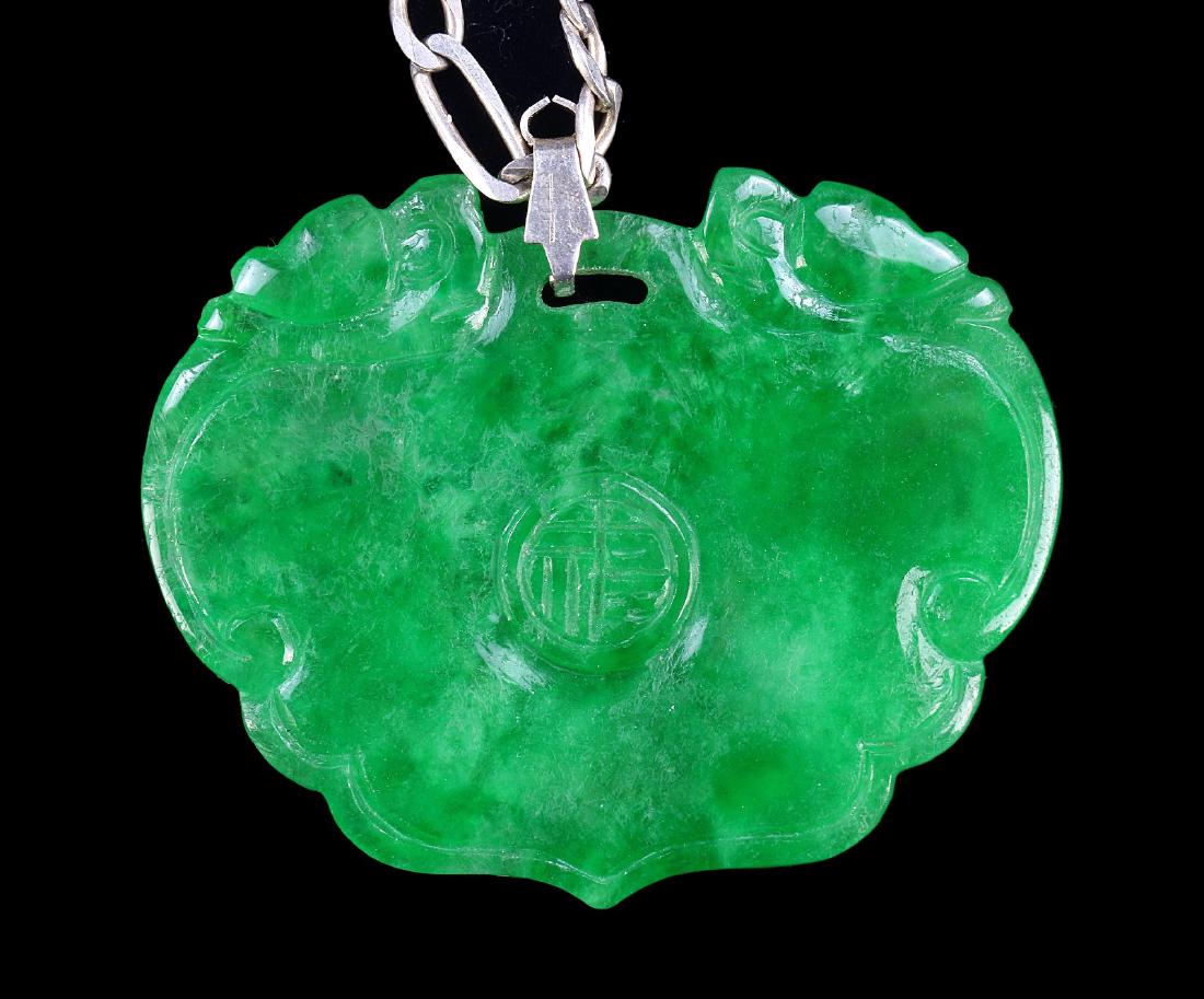 A JADEITE CARVED PENDANT (1 of 5)