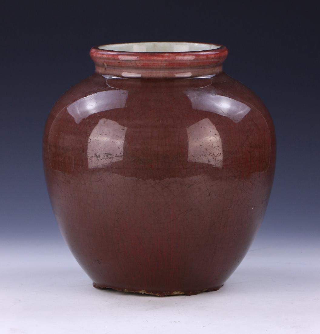 A CHINESE ANTIQUE OX BLOOD GLAZED PORCELAIN VASE: A Chinese Antique Ox Blood Glazed Porcelain Vase: Well Potted And Of Ovoid Form, Exterior Body Evenly Glazed in A Medium Ox Blood Tone With A Fine Crackle Finish; Size: H: 8-3/4" (22.23cm)