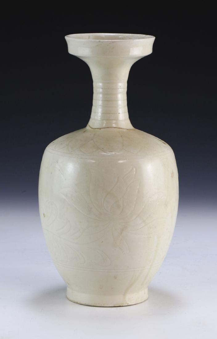 A CHINESE ANTIQUE WHITE GLAZED PORCELAIN VASE: A Chinese Antique White Glazed Porcelain Vase: Of Shouldered Form, Ridged Neck Rising To An Outwardly Flared Rim, Body Finely Painted With A Subtle Blooming Flower Design Amid A Crackle Glaze Finish;