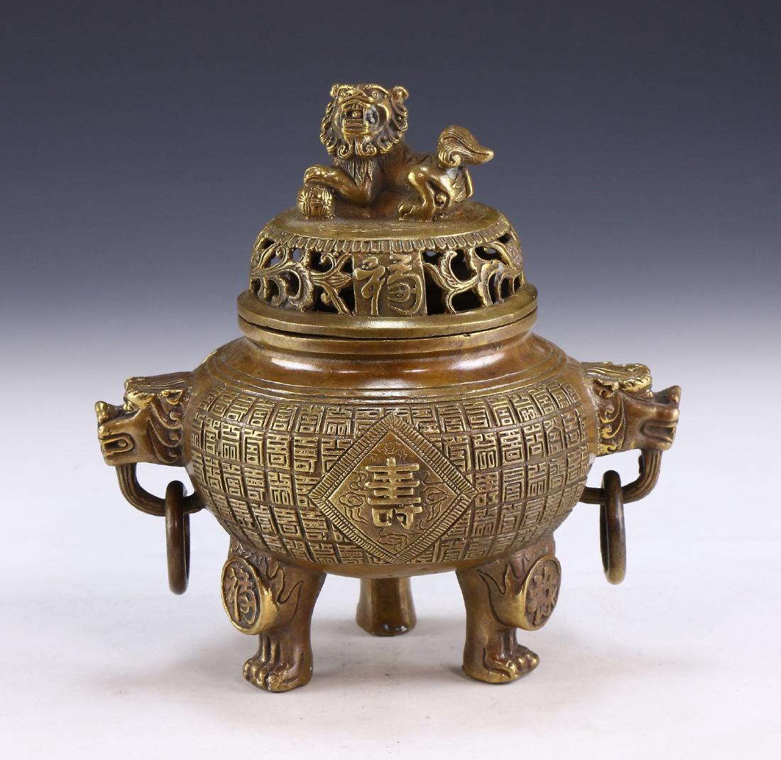 A CHINESE ANTIQUE LIDDED TRIPOD BRONZE CENSER (1 of 8)
