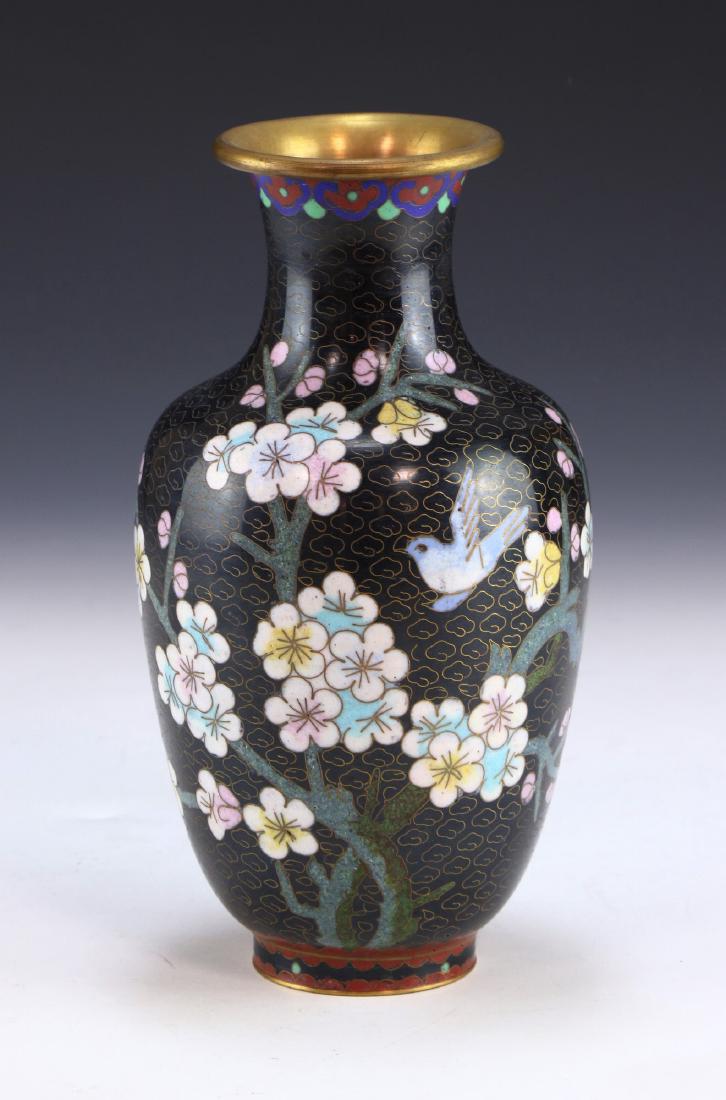 A CHINESE ANTIQUE CLOISONNE ON BRONZE VASE: A Chinese Antique Cloisonne On Bronze Vase: Of Ovoid Form, Body Finely Painted With A Bird in Flight Amid Sprouting Blossoms Of Mixed Tones And Thin Branches; Size: H: 8-1/4" (20.96cm)
