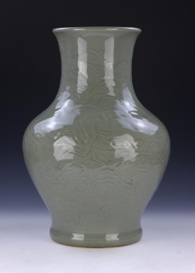 A BIG CHINESE ANTIQUE CELADON GLAZED PORCELAIN VASE: A Big Chinese Antique Celadon Glazed Porcelain Vase: Heavily Potted And Of Baluster Form, Rising From A Base Rested On Low Feet To A Lipped Rim, Exterior Body Finely Painted With A Swirling Dragon Ami