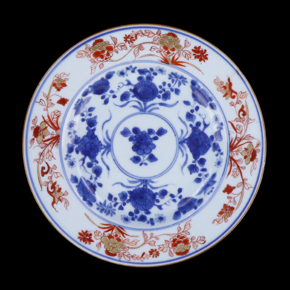 A CHINESE ANTIQUE FAMILLE ROSE PORCELAIN PLATE: A Chinese Antique Famille Rose Porcelain Plate: Of Rounded Sides, Rising From A Base Rested On Low Feet To A Lipped Rim, interior Body And Rim Finely Painted With Sprouting Blossoms Of Mixed Tones Ami