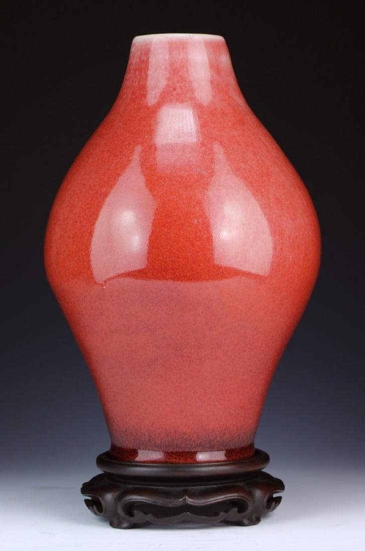 A CHINESE ANTIQUE OX BLOOD GLAZED PORCELAIN VASE (1 of 3)